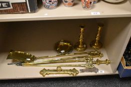 Brass ware comprising ashtrays, candlesticks and a part fire companion set etc.