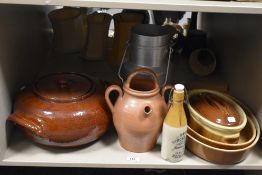 A stoneware ginger beer bottle manufactured by James Dunbar sold alongside a vintage milk churn, a