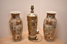 A 1920s Japanese porcelain Satsuma style table lamp, moulded with pendant ropes and decorated with