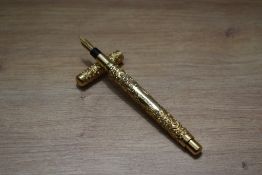 A Mabie Todd & Co Swan Eyedropper fountain pen in BHR with snail chaise gold fill and comes with te