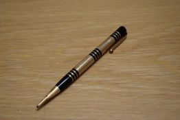 A Mabie Todd & Co Fyne Poynt propelling pencil set in black with gold overlay and several decorative