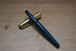 A Swan fountain pen and ballpoint pen set in green with gold cap