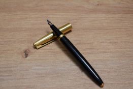 A boxed Conway Stewart 69 pressac fill fountain pen and propelling pencil set in black with gold cap
