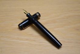 A Parker Duofold Special Streamlined button fill fountain pen in black with two bands to the cap