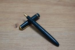 A boxed Parker Slimfold aerometric fill fountain pen in green having Parker 14k nib. Tassie missing,
