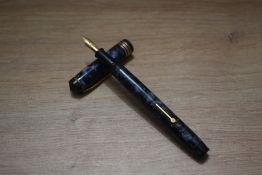 A Conway Stewart 388 lever fill fountain pen in blue black marble having Conway Stewart14ct gold
