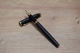 A boxed Cross Century aerometric fill fountain pen in matt black with gold trim having Cross M nib