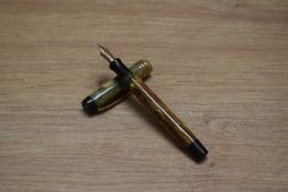 A Parker Duofold Deluxe Junior button fill fountain pen in bronze and gold with three cap bands