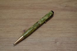 A Parker Duofold Deluxe propelling pencil in green and pearl with two narrow and one broad band