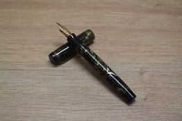 A Parker Duofold Deluxe Special button fill fountain pen in green and black marble with two narrow
