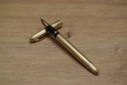 A Sheaffer TD Triumph touchdown fill fountain pen in gold fill with parallel line design having