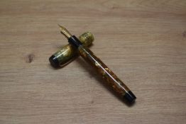 A Parker Duofold Deluxe Special button fill fountain pen in bronze and gold with three cap bands