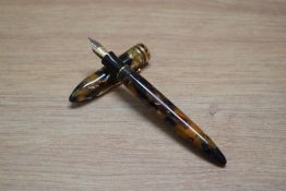 A Sheaffer Balance II cartridge converter fountain pen in amber glow with two cap bands having