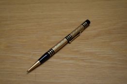 A Mabie Todd & Co Fyne Poynt propelling pencil set in black with gold overlay and several decorative