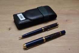 A Pelikan M800 piston fill fountain pen and ballpoint pen in Stone Garden design having Pelikan