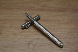 A Caran d'Ache Maya converter fill fountain pen in silver plate with maya scroll decal having