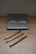 A Parker Sonnet converter fill fountain pen, ballpoint pen and propelling pencil set in reeded gold