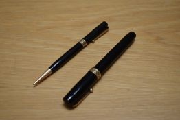 A Mabie Todd & Co Swan Visofil fountain pen and Fyne Poynt propelling pencil in black with pierced