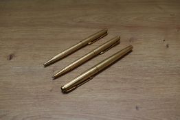 A Parker 50 Falcon Signet aero fill fountain pen, ballpoint pen and propelling pencil in gold