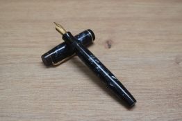 A Parker Duofold Senior button fill fountain pen in blue black marble with a single cap band