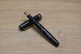 A Parker Duofold Junior button fill fountain pen in blue black marble with two cap bands having a