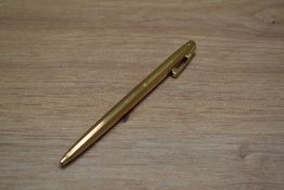 A Sheaffer 727 ballpoint pen in gold plated fluted pattern
