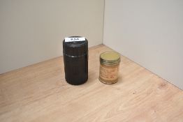 A bakelite screw top box holding a bottle of Parker Quink ink and an original postage pot from Jane