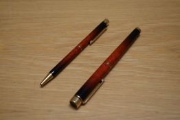 A Sheaffer Targa 1035 Classic converter cartridge fill fountain pen and ballpoint pen in laque amber