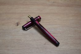A Mabie Todd & Co Swan leverless twist fill fountain pen in burgundy lizard skin with one narrow