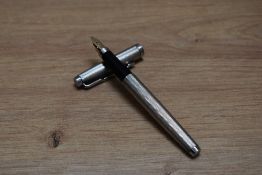 A Parker 75 cartridge fill fountain pen in silver plate Grain d'Orge design having Parker 14K