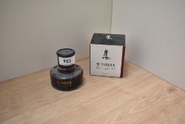 A bottle of Penman Parker writing ink in Ruby