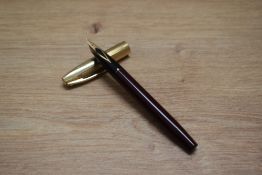 A Sheaffer Imperial VIII touchdown fill fountain pen in burgundy with gold cap having Sheaffer 14k