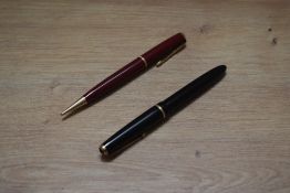 A Parker Slimfold aerometric fill fountain pen in black with single cap band having Parker 14k 585