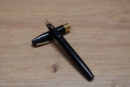A Sheaffer Imperial IV cartridge fill fountain pen in black with gold trim having Sheaffer 14K 585