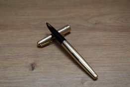 A Parker 61 Insignia converter fill fountain pen in gold plate