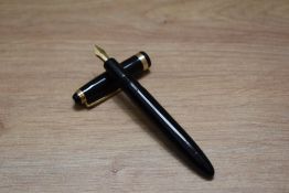 A Montblanc 202 button fill fountain pen in black with broad cap band having a 14 Karat 2 nib