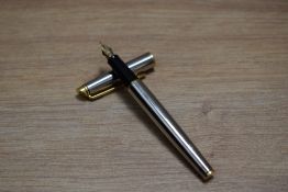 A Waterman Hemisphere converter fill fountain pen in chrome with gilt trim having Waterman Paris M