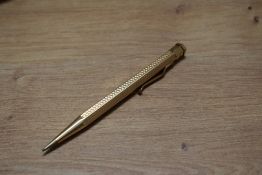 A cased Yard o Led propelling pencil in rolled gold, hexagonal shape with wave decal