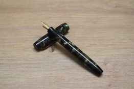 A Parker Duofold Deluxe Special Streamline button fill fountain pen in green and black marble with