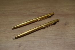 A Parker Classic ballpoint pen and propelling pencil set in rolled gold perle design