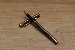 A Sheaffer TRZ Targa slim cartridge fill fountain pen in black and gold with etched patterned panels