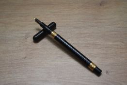 A Mabie Todd & Co Swan Eyedropper fill fountain pen in BHR with two snail trail gold bands to the