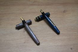 Two Mabie Todd & Co Swan 192/92 and 192/94 lever fill fountain pens one in grey red wood grain the