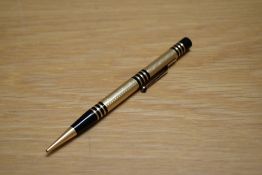 A Mabie Todd & Co Fyne Poynt propelling pencil set in black with gold overlay and several decorative