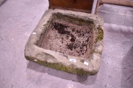A large stone trough, approx. 52 x 50cm, height 16cm