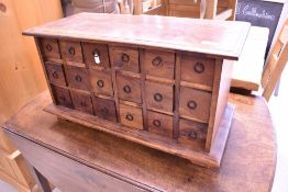 A modern hardwood spice chest, approx. dimensions W65cm H34cm D29cm