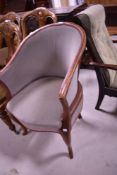 A late 19th or early 20th Century mahogany framed tub chair