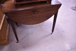 A 19th Century mahogany breakfast table in the Pembroke style, having frieze drawer and square