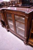 A 19th Century walnut pier cabinet having line inlay decoration, brass detailing and pillar