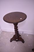 A 19th Century mahogany occasional table having circular top, twist column and William IV style